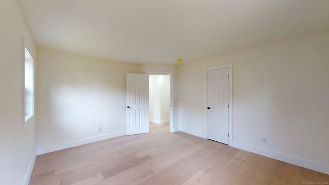 101 Parade Hill Rd, New Canaan, CT 06840 - unfurnished bedroom with light wood-type flooring and baseboards