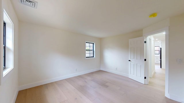 101 Parade Hill Rd, New Canaan, CT 06840 - empty room with visible vents, baseboards, and light wood-type flooring
