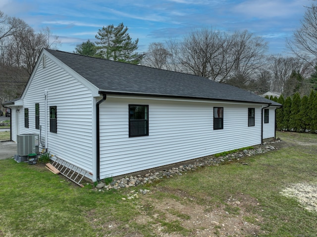 101 Parade Hill Rd, New Canaan, CT 06840 - view of home's exterior featuring roof with shingles, central AC unit, and a lawn