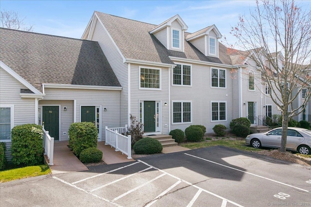 view of front of property featuring uncovered parking