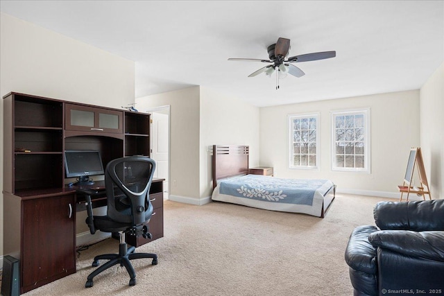 carpeted bedroom featuring baseboards and ceiling fan