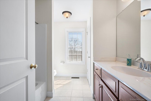 bathroom with toilet, tile patterned floors, vanity, baseboards, and visible vents