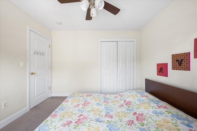 bedroom with ceiling fan, baseboards, dark colored carpet, and a closet