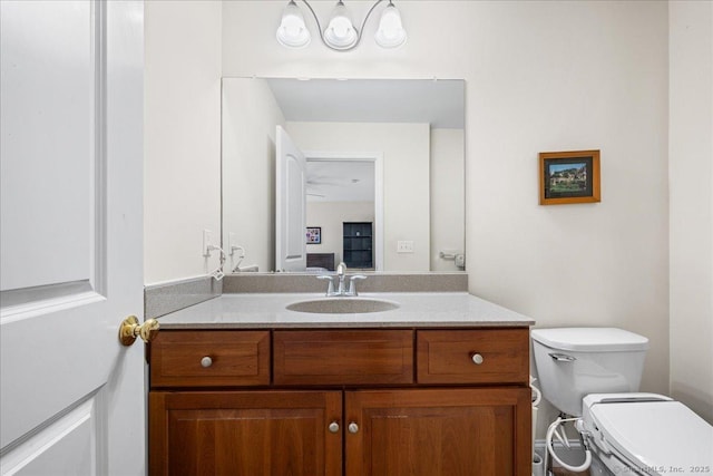 half bathroom with toilet and vanity