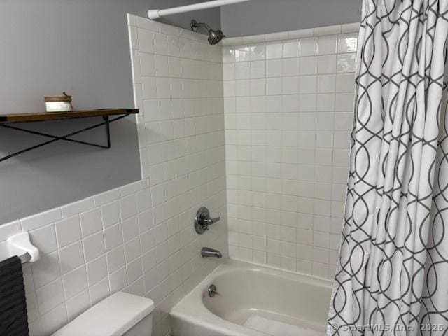 full bath featuring toilet and shower / tub combo with curtain