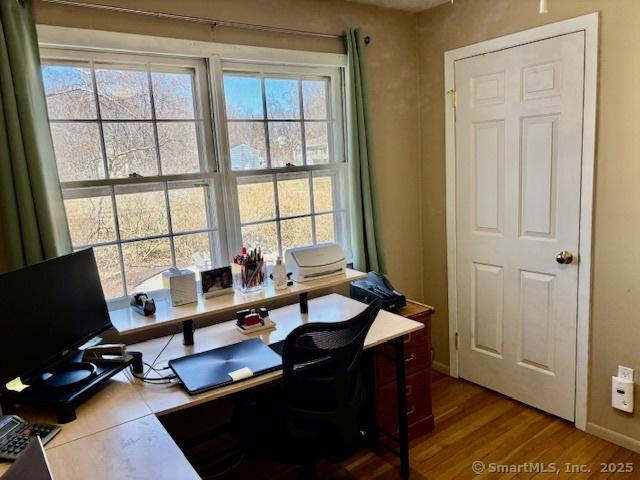 office with wood finished floors and baseboards