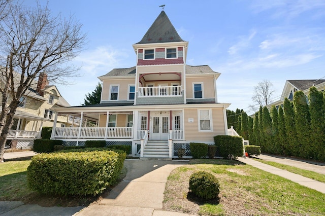 56-58 E Main St, Stonington, CT 06355 - victorian house with french doors, covered porch, and a balcony