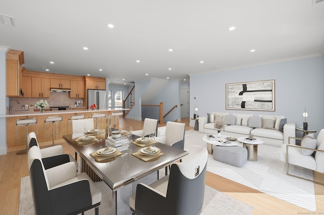 56-58 E Main St, Stonington, CT 06355 - dining room with recessed lighting, crown molding, stairs, light wood-style floors, and visible vents