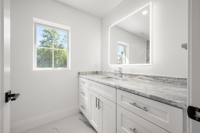 56-58 E Main St, Stonington, CT 06355 - bathroom with marble finish floor, vanity, and baseboards