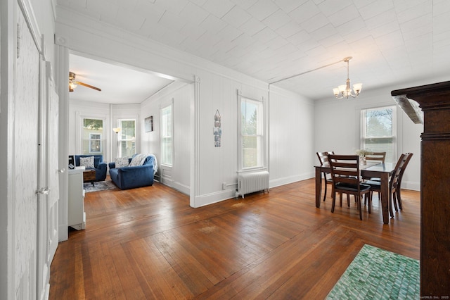56-58 E Main St, Stonington, CT 06355 - dining room featuring baseboards, ornamental molding, ceiling fan with notable chandelier, wood-type flooring, and radiator heating unit