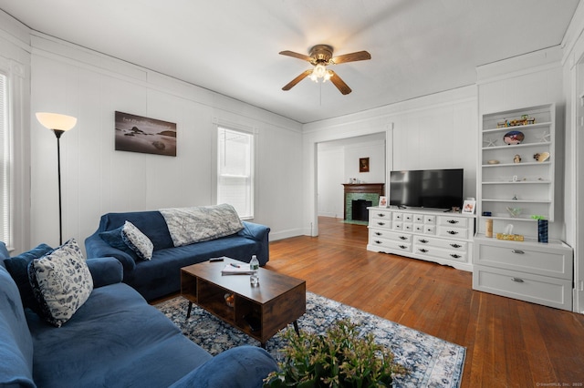 56-58 E Main St, Stonington, CT 06355 - living area featuring wood finished floors, ornamental molding, and ceiling fan
