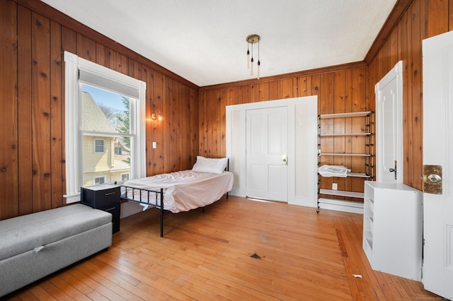 56-58 E Main St, Stonington, CT 06355 - bedroom featuring light wood-style flooring and wooden walls
