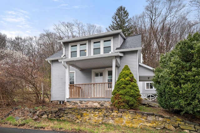 view of front of home featuring a porch and a shingled roof