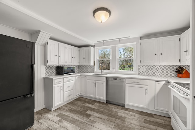 kitchen featuring white electric range oven, freestanding refrigerator, dishwasher, light countertops, and a sink