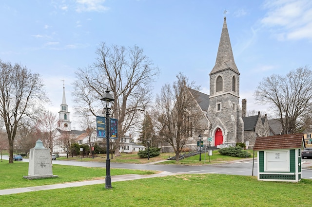 view of home's community with a yard