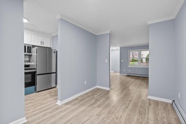 kitchen with white cabinets, a baseboard radiator, ornamental molding, and appliances with stainless steel finishes