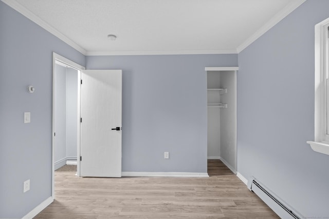 unfurnished bedroom with a closet, a baseboard radiator, ornamental molding, and wood finished floors