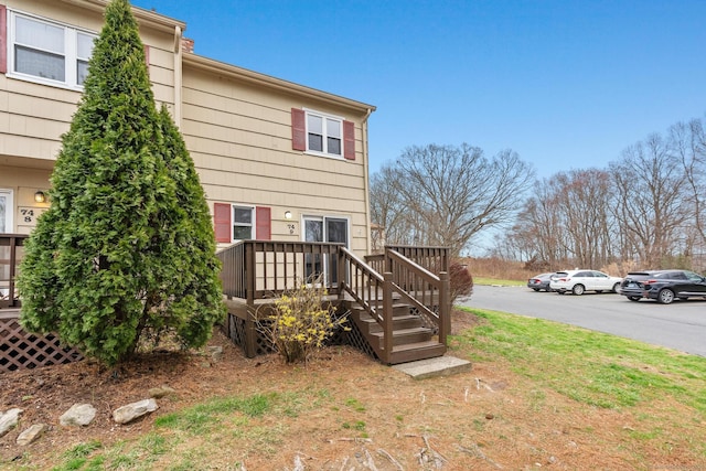 rear view of property with a wooden deck