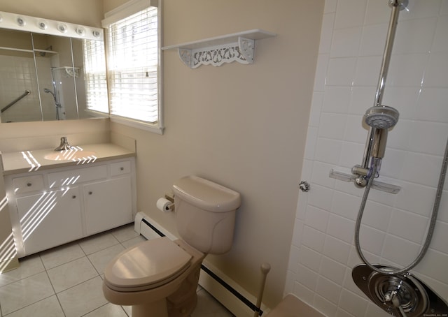 full bath with toilet, vanity, tile patterned flooring, baseboard heating, and tiled shower