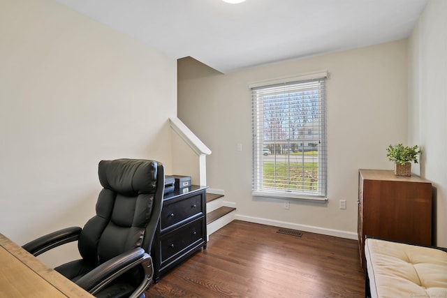office space featuring baseboards, visible vents, and dark wood-style floors