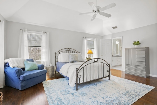 bedroom with vaulted ceiling, wood finished floors, multiple windows, and visible vents