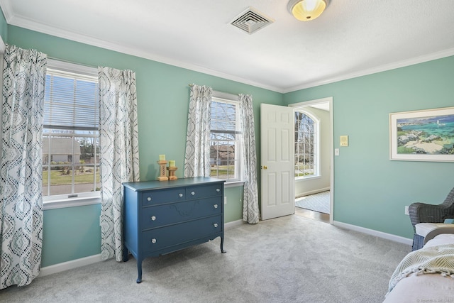 sitting room featuring baseboards, ornamental molding, visible vents, and carpet
