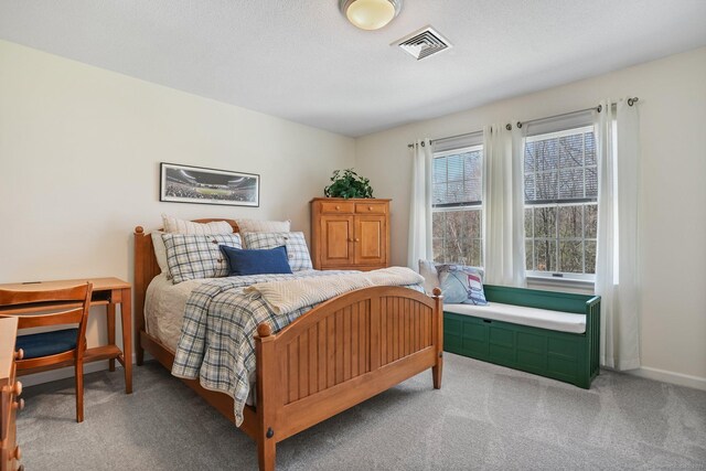 bedroom featuring visible vents and carpet