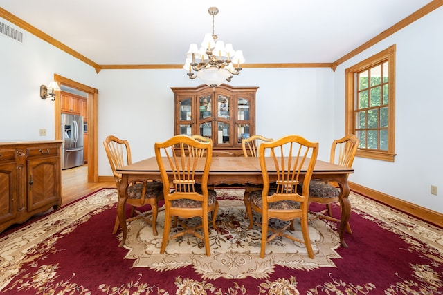40 Old Bridge Rd, Brookfield, CT 06804 - dining space with crown molding, visible vents, a chandelier, and light wood-style floors