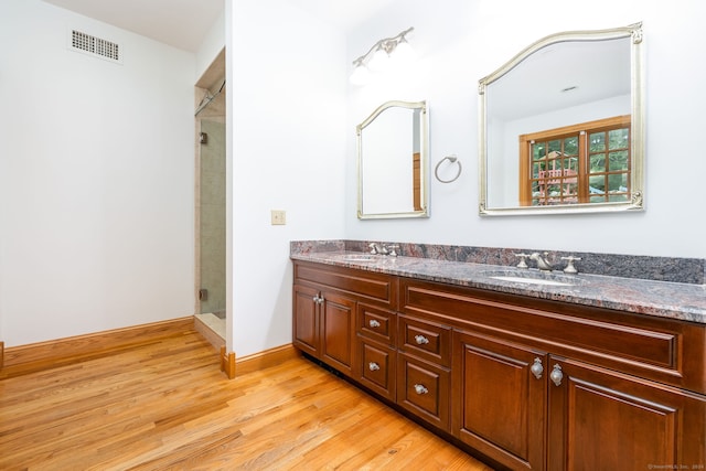 40 Old Bridge Rd, Brookfield, CT 06804 - full bath with a sink, visible vents, double vanity, and wood finished floors