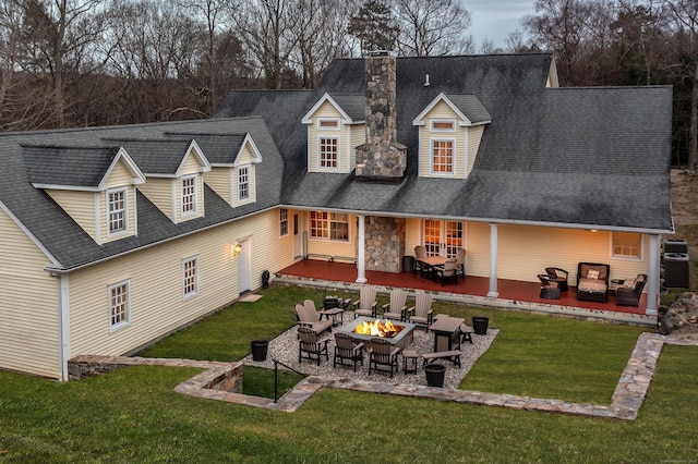 40 Old Bridge Rd, Brookfield, CT 06804 - back of house featuring a patio, a shingled roof, a fire pit, and a lawn
