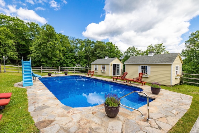 40 Old Bridge Rd, Brookfield, CT 06804 - view of swimming pool featuring an outdoor structure, a fenced backyard, a storage structure, a patio, and a water slide