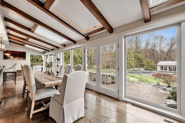 77 Eastfield Rd, Waterbury, CT 06708 - sunroom / solarium with wood finished floors, visible vents, lofted ceiling with skylight, french doors, and a notable chandelier