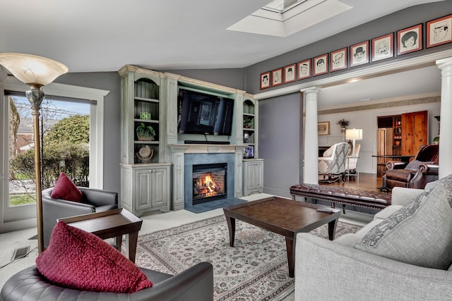 77 Eastfield Rd, Waterbury, CT 06708 - living room featuring ornate columns, carpet floors, a high end fireplace, visible vents, and lofted ceiling with skylight