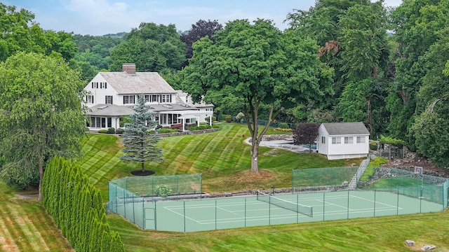 77 Eastfield Rd, Waterbury, CT 06708 - view of tennis court featuring fence and a yard