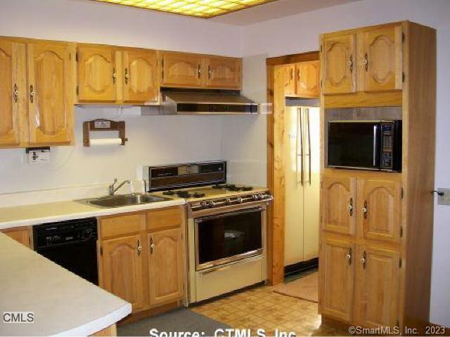197 Lee Farm Dr, Southbury, CT 06488 - kitchen featuring black appliances, range hood, a sink, light countertops, and light floors