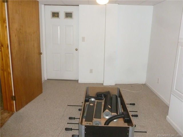 spare room featuring carpet flooring and baseboards