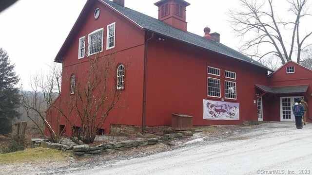 197 Lee Farm Dr, Southbury, CT 06488 - view of property exterior with a chimney