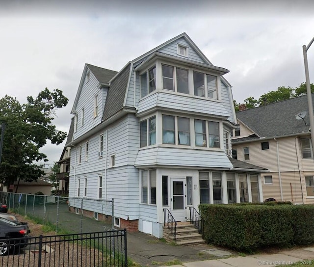 view of front of home with fence