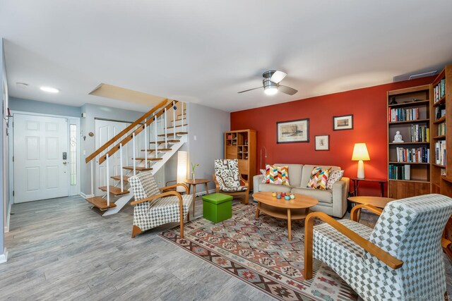 199 Gregory Blvd Apt F1, Norwalk, CT 06855 - living room featuring stairway, ceiling fan, wood finished floors, and baseboards
