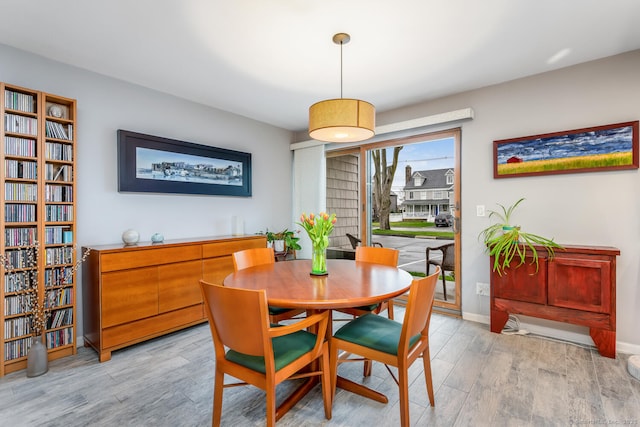 199 Gregory Blvd Apt F1, Norwalk, CT 06855 - dining space featuring light wood-type flooring and baseboards