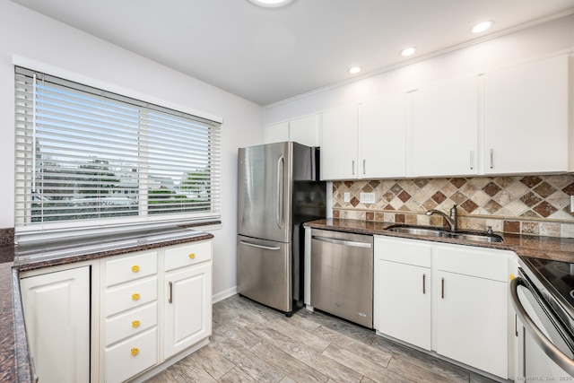 199 Gregory Blvd Apt F1, Norwalk, CT 06855 - kitchen featuring appliances with stainless steel finishes, a sink, backsplash, dark stone countertops, and recessed lighting