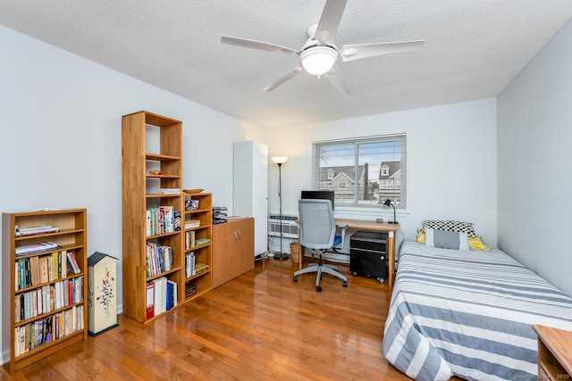 199 Gregory Blvd Apt F1, Norwalk, CT 06855 - bedroom with hardwood / wood-style floors and a textured ceiling