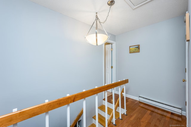 199 Gregory Blvd Apt F1, Norwalk, CT 06855 - corridor with baseboard heating, hardwood / wood-style flooring, and baseboards