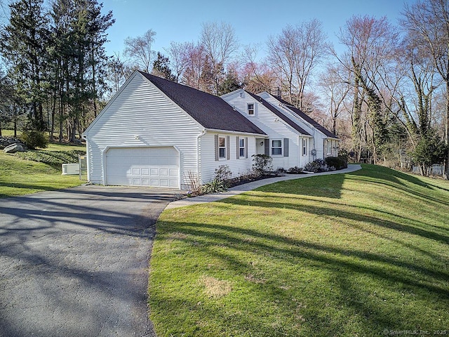 10 Edgehill Dr, Woodbridge, CT 06525 - view of front of property featuring a front lawn, driveway, an attached garage, and roof with shingles