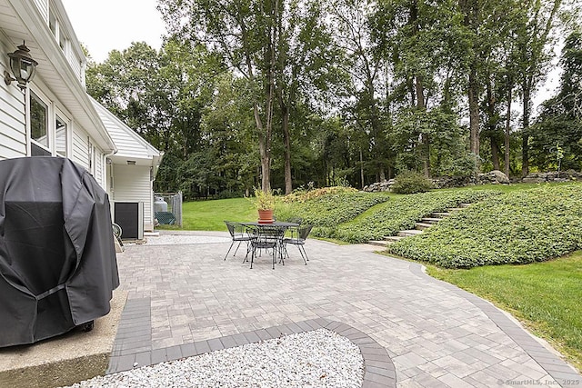 10 Edgehill Dr, Woodbridge, CT 06525 - view of patio / terrace with outdoor dining area, view of scattered trees, and a grill