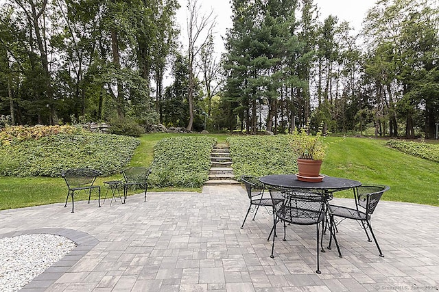 10 Edgehill Dr, Woodbridge, CT 06525 - view of patio featuring stairs and outdoor dining space