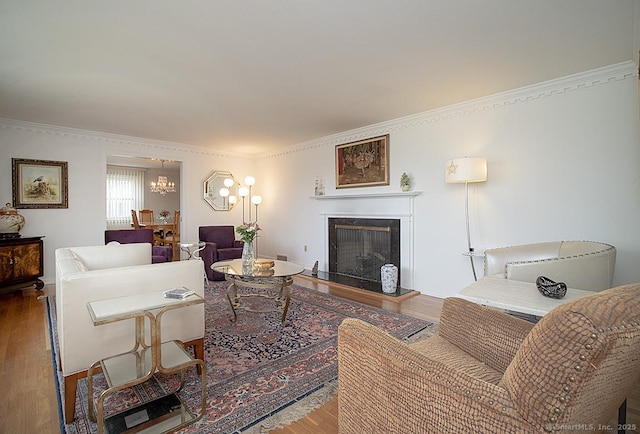 10 Edgehill Dr, Woodbridge, CT 06525 - living area featuring wood finished floors, a fireplace, and crown molding