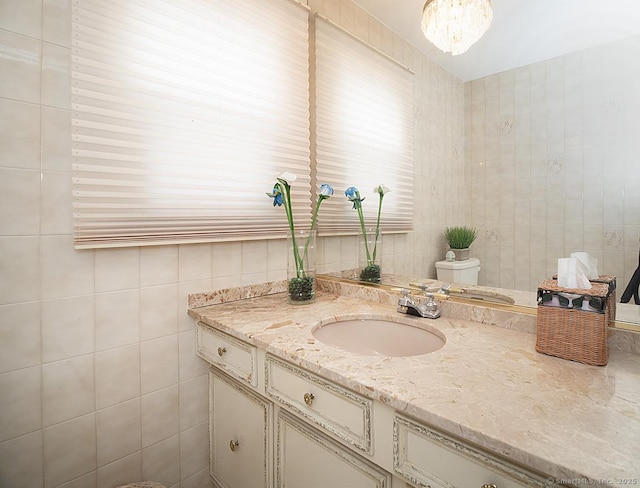 10 Edgehill Dr, Woodbridge, CT 06525 - bathroom featuring vanity, tile walls, and toilet