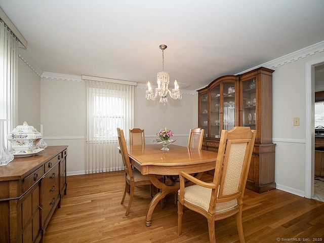 10 Edgehill Dr, Woodbridge, CT 06525 - dining area featuring light wood finished floors, a chandelier, baseboards, and crown molding