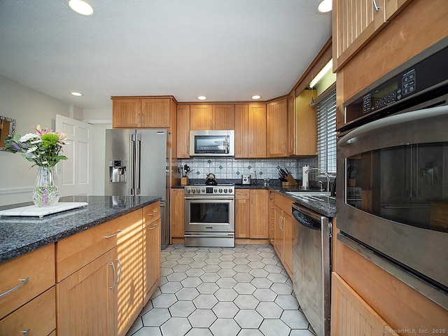 10 Edgehill Dr, Woodbridge, CT 06525 - kitchen with appliances with stainless steel finishes, a sink, decorative backsplash, dark stone counters, and recessed lighting